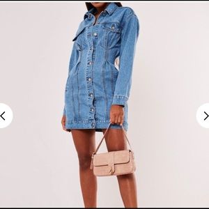 Blue denim dress with cinched waist.